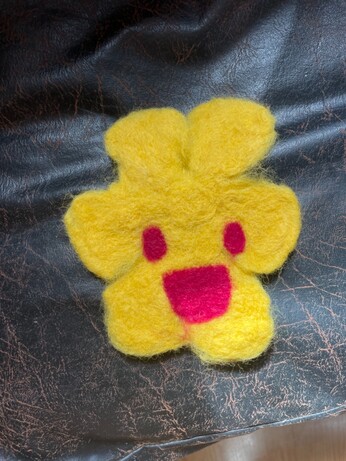 Felted monkeyflower with happy face