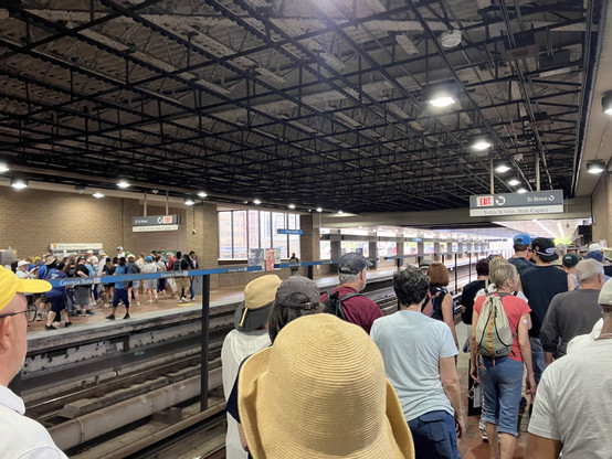 Scene in the elevated Georgia State MARTA station. Trains have just pulled away in both directions, and both platforms are complete full of people heading to the protest