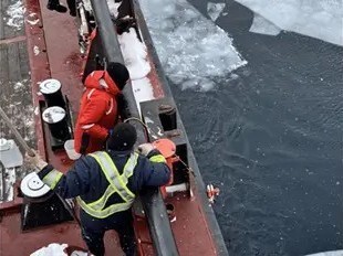 image/jpeg two crew members on a large ship deploy a device over the side amongst ice floes.
Photo from DFO of work on the CCGS Samuel Risley Feb 2025.