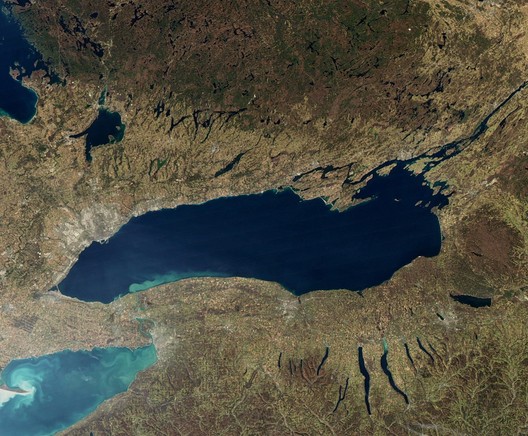 image/jpeg a satellite image of Lake Ontario is dark blur against the brown of the watershed. MODIS NASA November 2009.